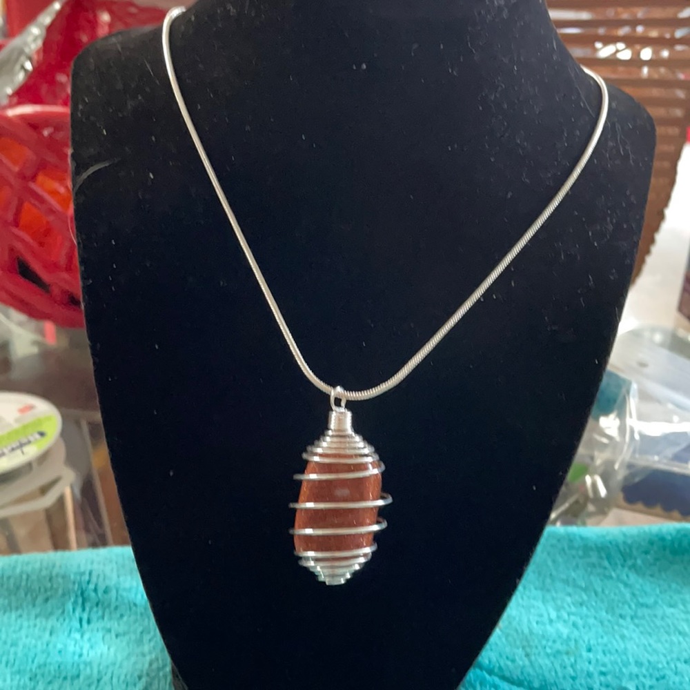 Copper stone in cage for life